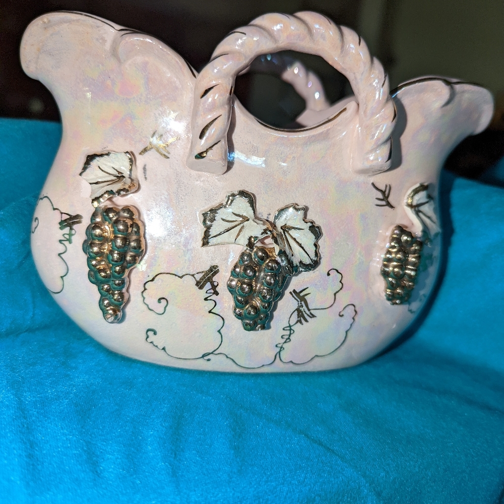 Pink iridescent colored  vase with handles. Grapes in gold tone. I didn't say no